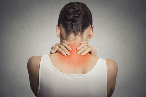 woman holding sore neck with two hands