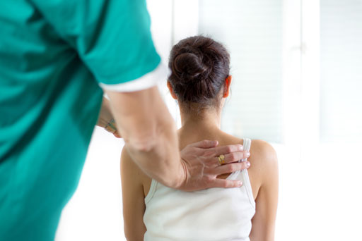 woman recieving a chiropractic adjustment